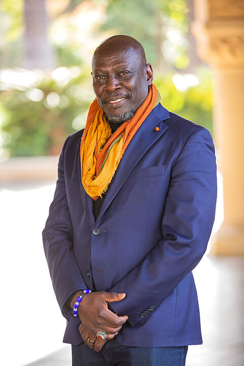 Photo showing Ato Quayson in a blue suit